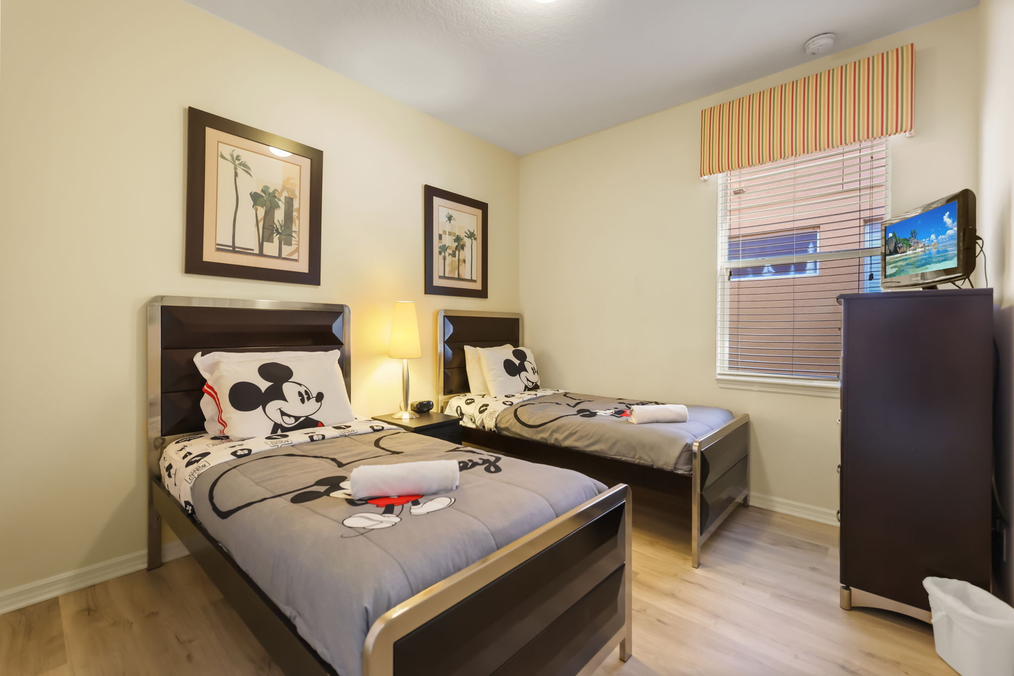 Disney-themed twin bedroom at 183 Tiger Lily Court